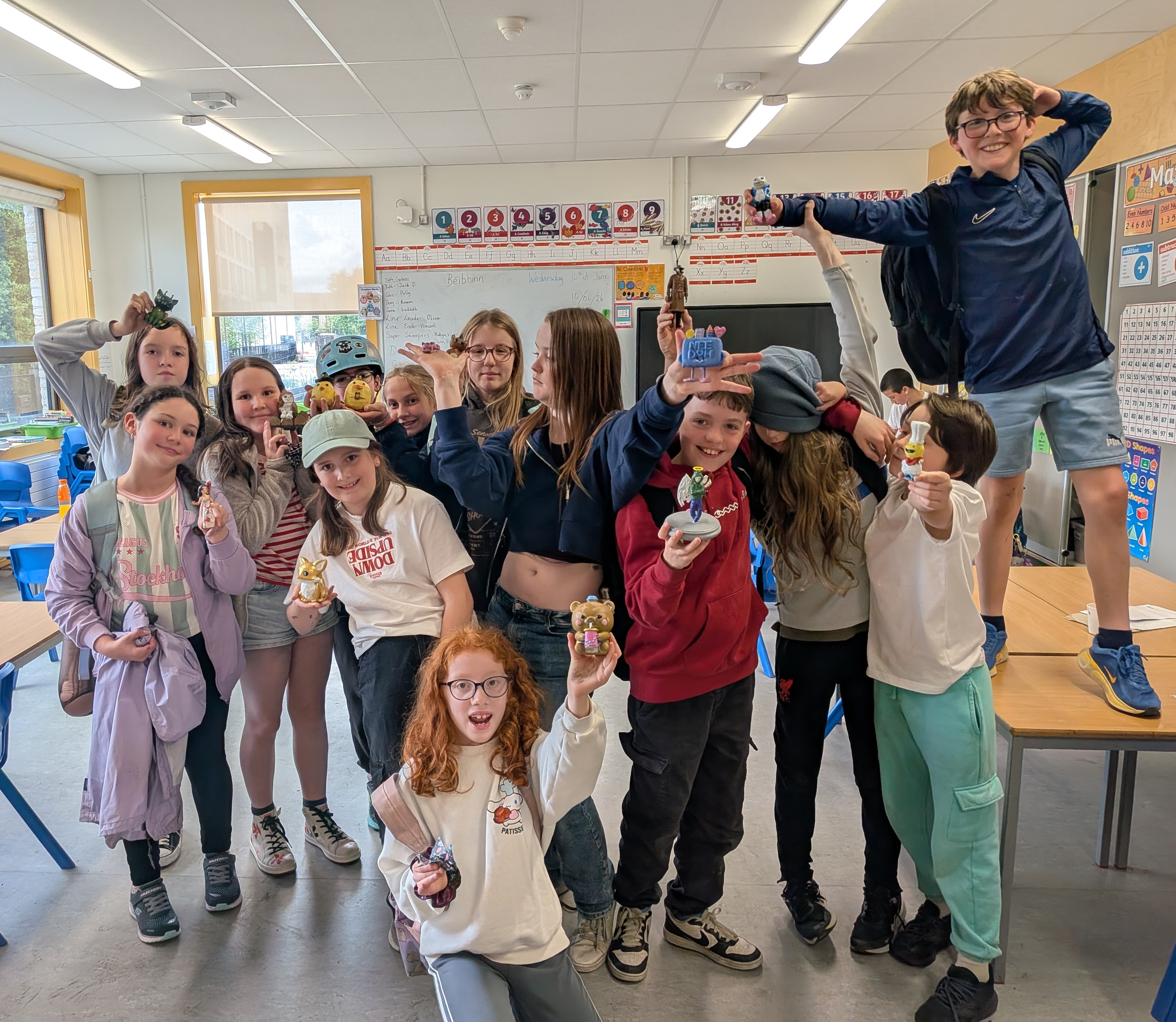 BLANK Canvas Academy students proudly showing their 3D printed and hand-painted figures in a Dublin classroom